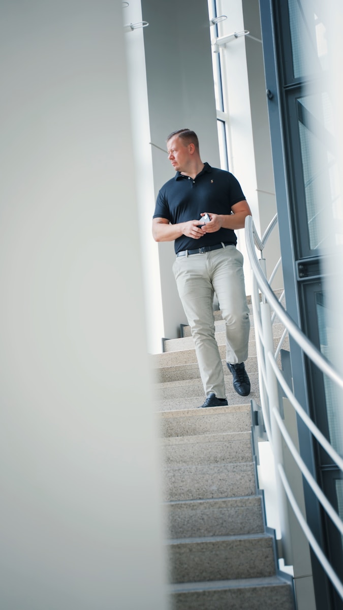 a man standing on a set of stairs, insurance agency